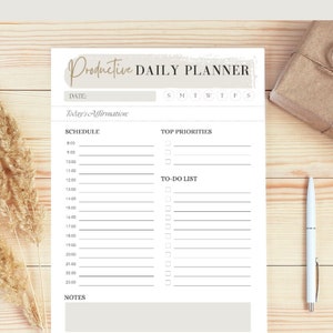 May include: A printable daily planner with a white background and black text. The planner includes sections for scheduling, top priorities, and a to-do list. The planner also includes a section for notes. The text "Productive Daily Planner" is at the top of the page.