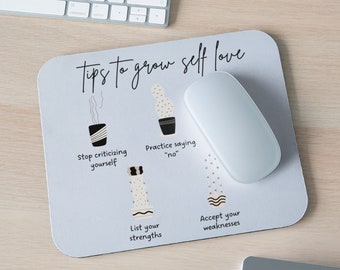 May include: A light blue mouse pad with the text "tips to grow self love" and four illustrations of potted plants with text below each illustration. The text below the illustrations reads "Stop criticizing yourself", "Practice saying "no"", "List your strengths", and "Accept your weaknesses".