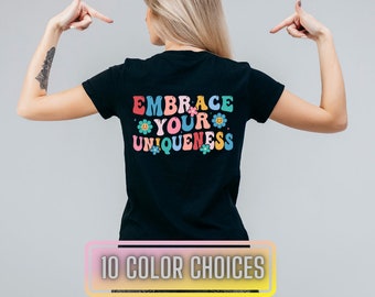 May include: Black t-shirt with the text "EMBRACE YOUR UNIQUENESS" in rainbow colours with flower accents. 10 colour choices.
