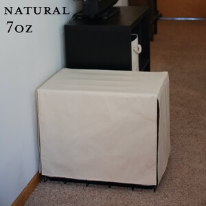 May include: A white canvas dog crate cover with the text "NATURAL 7OZ" on a white wall.
