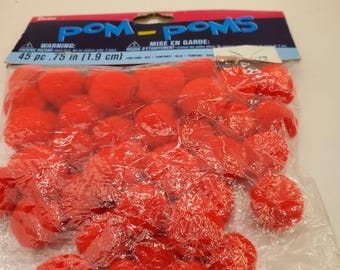 May include: A pack of 45 red pom-poms, each measuring 1.9 cm in diameter. The pom-poms are packaged in a clear plastic bag with a colourful label that reads "POM-POMS" and includes a warning and instructions in both English and French.