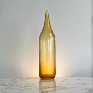 Tall signed handblown fluted vase in amber satin glass