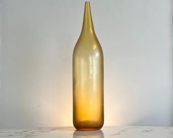 Tall handblown fluted vase in amber satin glass
