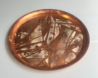 Round copper serving tray in Brutalist design