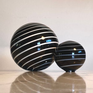 Set of two handmade striped globe table decorations in striped black and white glass image 1