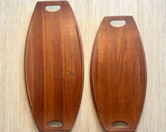 Pair of Dansk nestling teak trays by Jens Quistgaard with duck marks logo