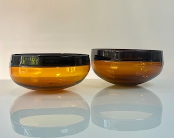 Pair of Large incalmo glass bowls by Steven Correia in amber and amethyst glass