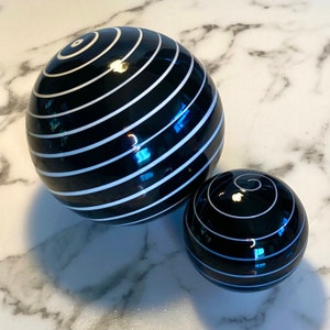 Set of two handmade striped globe table decorations in striped black and white glass image 3