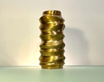 brutalist metal vase with wave design in brass finish