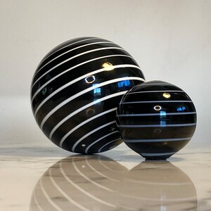 Set of two handmade striped globe table decorations in striped black and white glass image 2