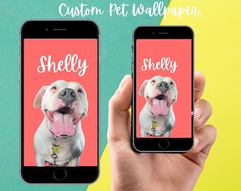 May include: A custom phone wallpaper featuring a white dog with a pink tongue sticking out. The dog's name, "Shelly", is written in white cursive on a pink background.