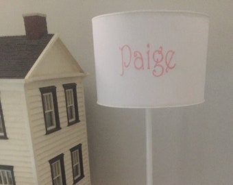 Personalized floor lamp with white drum shade naturally fits with any room decor.