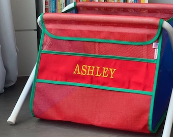 Personalized kid's toy box. Safe. Large capacity. And portable -easily take it anywhere. Made in the USA. Red mesh with red canvas band.