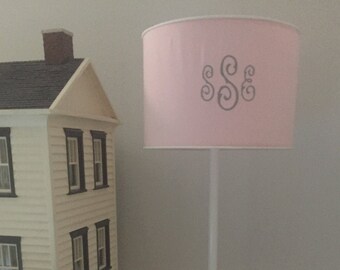 Personalized floor lamp for kids with drum shade in pink, solid brass fittings and virtually indestructible, powder-painted post.