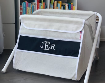 Personalized kid's toy box. Safe. Large capacity. And portable -easily take it anywhere. Made in the USA. White mesh/black panel.