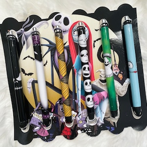 May include: Set of six black, white, green, and blue pens with various Nightmare Before Christmas character designs. The pens feature characters like Jack Skellington, Sally, and Oogie Boogie.