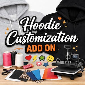 Puede incluir: Una sudadera con capucha gris y otra negra con el texto Hoodie Customization ADD ON. Incluye una prensa de calor negra, carretes de hilo rosa, negro y blanco, tijeras y varias muestras de tela en colores sólidos y estampado de leopardo.