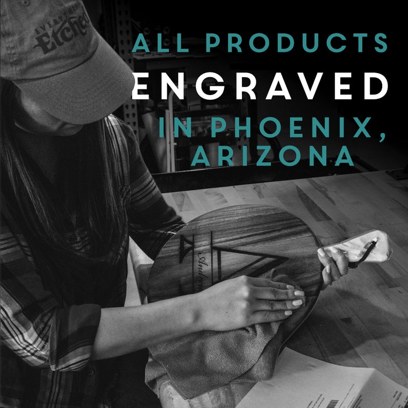 May include: A person is working on a wooden cutting board with a design engraved on it. The cutting board is round and has a handle. The text "ALL PRODUCTS ENGRAVED IN PHOENIX, ARIZONA" is displayed in the background.