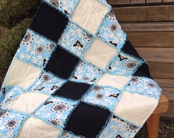 Handmade Baby Rag Quilt, designed in aqua blue medallion with ivory and black solids. 100% soft flannel quilt. Crib quilt or lap throw quilt