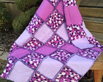 Purple floral handmade Baby Rag Quilt, designed with "Regal Orchid" floral and lilac and violet solids. 100% soft flannel quilt.  Crib quilt