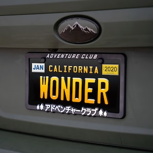 Japanese License Plate Frame JDM Tag Holder Made in the USA "Adventure Club" by Wonder Plate Frames