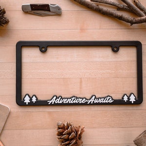 License Plate Frame &quot;Adventure Awaits&quot; by Wonder Plate Frames