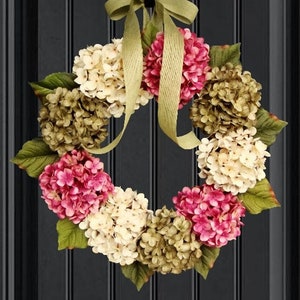 spring hydrangea wreath on a dark door