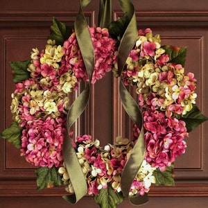 pink spring hydrangea wreath on a wood front door