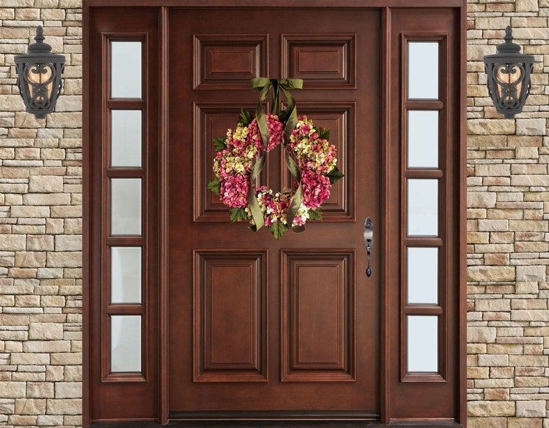 pink spring hydrangea wreath on a wood front door