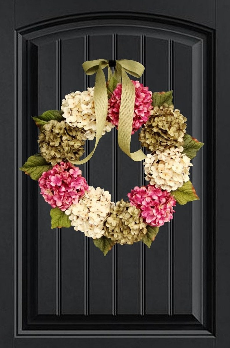 spring hydrangea wreath on a dark door