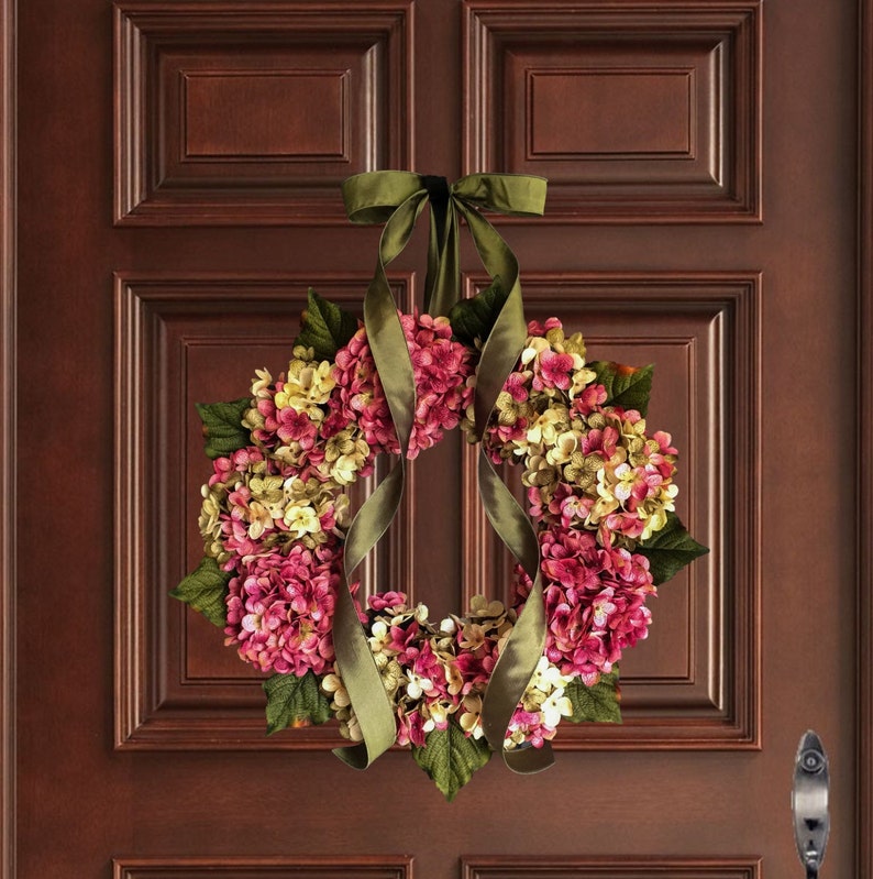 pink spring hydrangea wreath on a wood front door