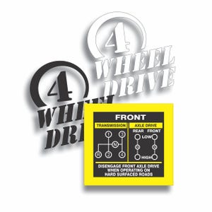 May include: Image features a yellow and black 4-wheel drive diagram with text. The diagram shows transmission and axle drive settings. The words "4 WHEEL DRIVE" are displayed in white and black. The text "DISENGAGE FRONT AXLE DRIVE WHEN OPERATING ON HARD SURFACED ROADS" is also present.