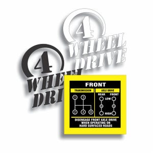 May include: A graphic with the words "4 WHEEL DRIVE" in white and black. A yellow square displays a diagram of a transmission and axle drive, with the text "FRONT" and instructions for use.