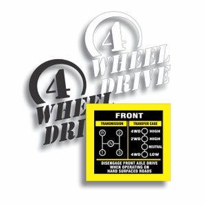 May include: White and black 4 Wheel Drive decals with a yellow and black sticker showing transmission and transfer case diagrams. The sticker includes text about disengaging the front axle drive.