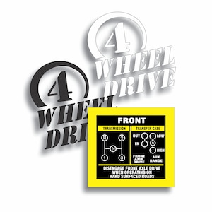 May include: A white and black graphic with the words "4 WHEEL DRIVE". A yellow and black sticker shows a diagram of a transmission and transfer case, with the text "FRONT" and "DISENGAGE FRONT AXLE DRIVE WHEN OPERATING ON HARD SURFACED ROADS".
