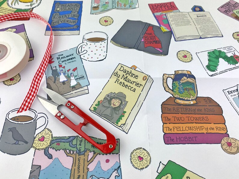 May include: A white background with colorful illustrations of books, mugs, and biscuits. The books include titles like "Treasure Island", "The Railway Children", "The Hobbit", and "The Blidly Chamber".