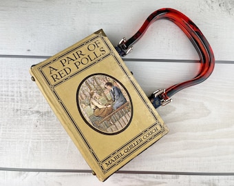 Vintage Book Handbag, A Pair of Red Polls, Mabel Quiller Couch, Amber Resin Handles