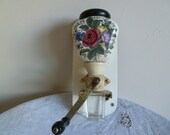 Decorative and colourful Wall hanging english Coffee grinder complete with lid and glass measure.