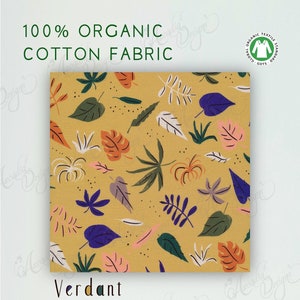 May include: A yellow fabric with a leafy pattern in shades of green, blue, pink, and orange. The fabric is 100% organic cotton and is GOTS certified. It is 44 inches wide and is suitable for quilting, apparel, and home decor accents. The fabric is described as "Verdant" and is part of the "Garden of Eden Collection".