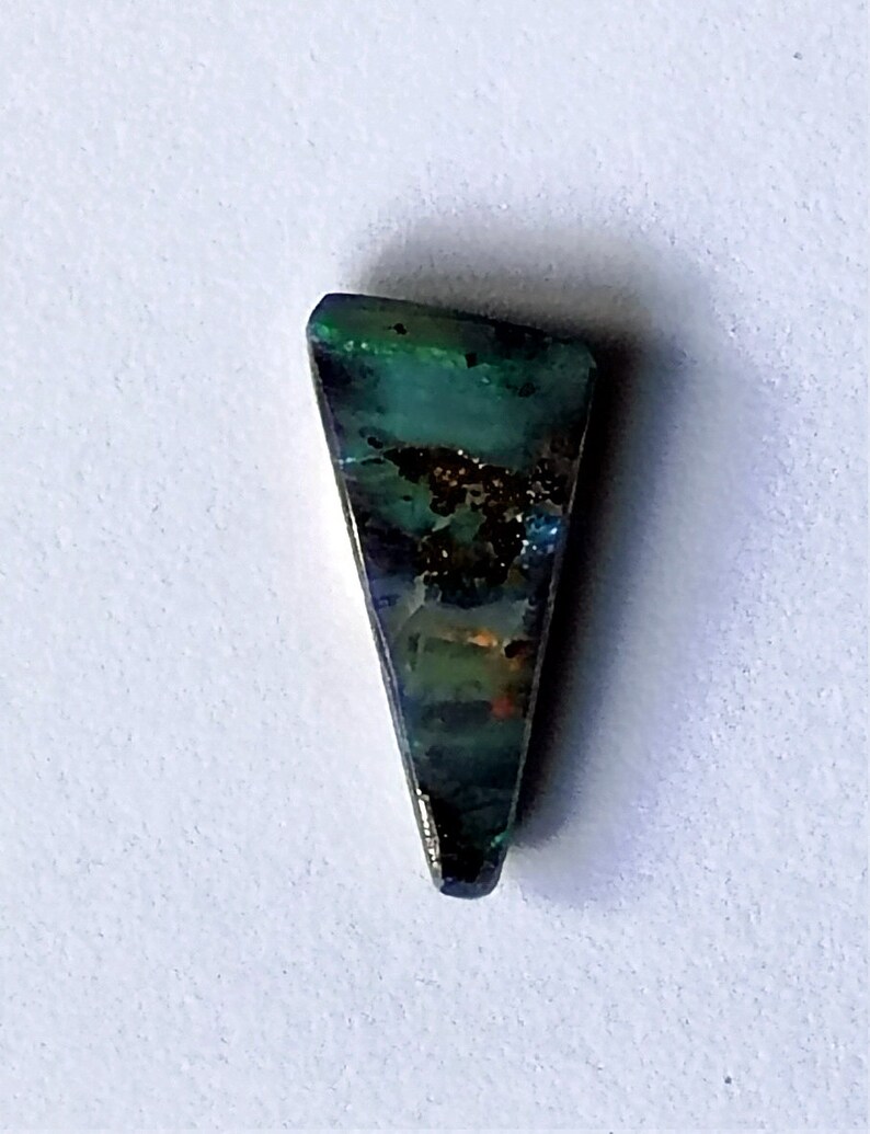 A small Winton boulder opal with an unusual triangular shape