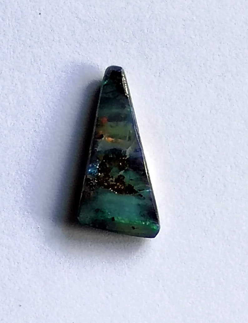 A small Winton boulder opal with an unusual triangular shape