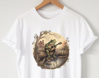 Cottagecore Aesthetic Frog playing instrument on a log shirt, Organic, unisex, frog T-shirt, Cottage core clothing, frog and toad,fairy core