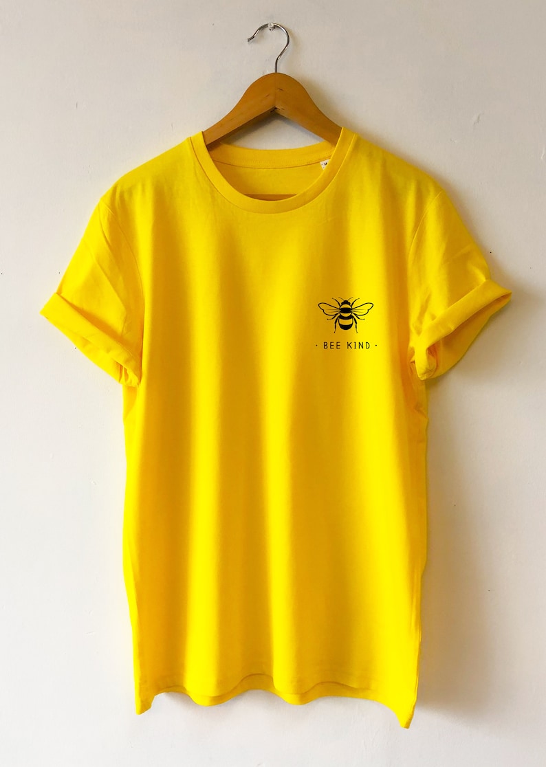 May include: A bright yellow t-shirt with a black bee graphic and the text "BEE KIND" on the front.