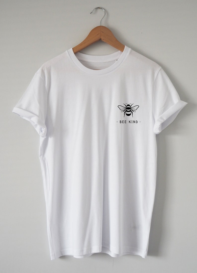 May include: White t-shirt with a black bee graphic and the text "BEE KIND" on the front.