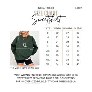 May include: Size chart for a Gildan 18000 sweatshirt, showing measurements in inches for width, length, and sleeve length for sizes S through 5XL. The chart shows a model wearing a size XL sweatshirt.