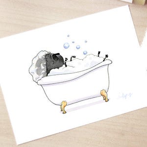 May include: A black pug dog is taking a bath in a white bathtub with bubbles. The pug is lying on its back with its paws in the air. The bathtub has gold feet.
