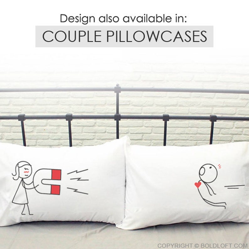 May include: Two white couple pillowcases with black line drawings. One shows a person with a magnet, the other a person with a heart. Text above reads "Design also available in: COUPLE PILLOWCASES".