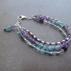 Multi-strand handmade blue fluorite, banded fluorite, amethyst, almadine garnet and Hill Tribes silver beaded bracelet