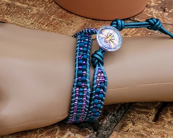 Metallic aqua leather double wrap bracelet with aqua and iridescent orchid colored glass seed beads