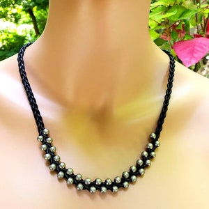 Braided leather and silver metal bead necklace